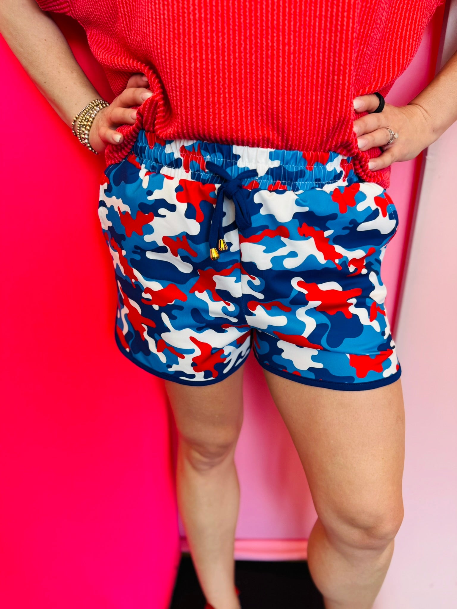 Americana camo shorts with red white and blue patriotic print.