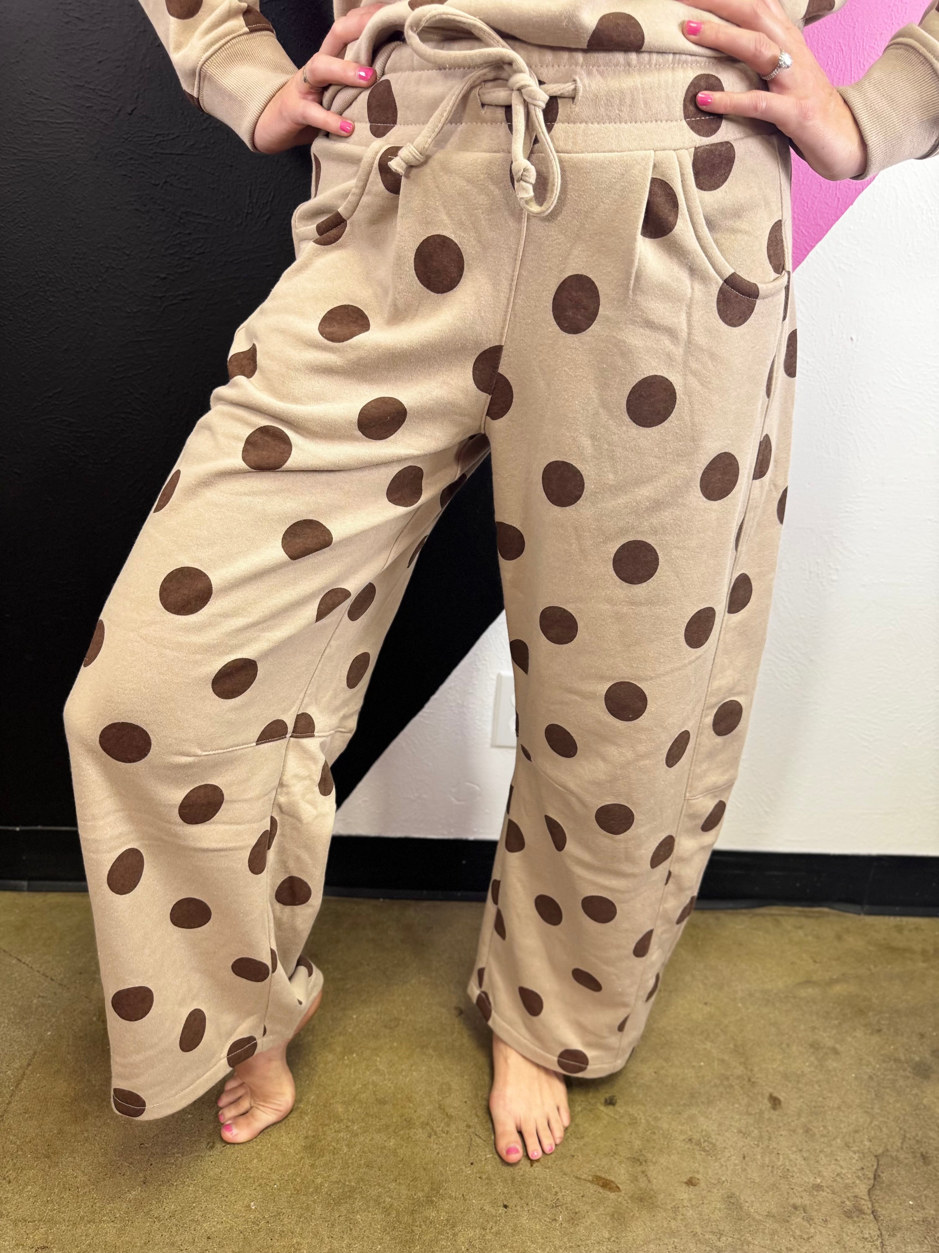 Ash mocha barrel-leg pants with bold brown polka dots and elastic waistband.