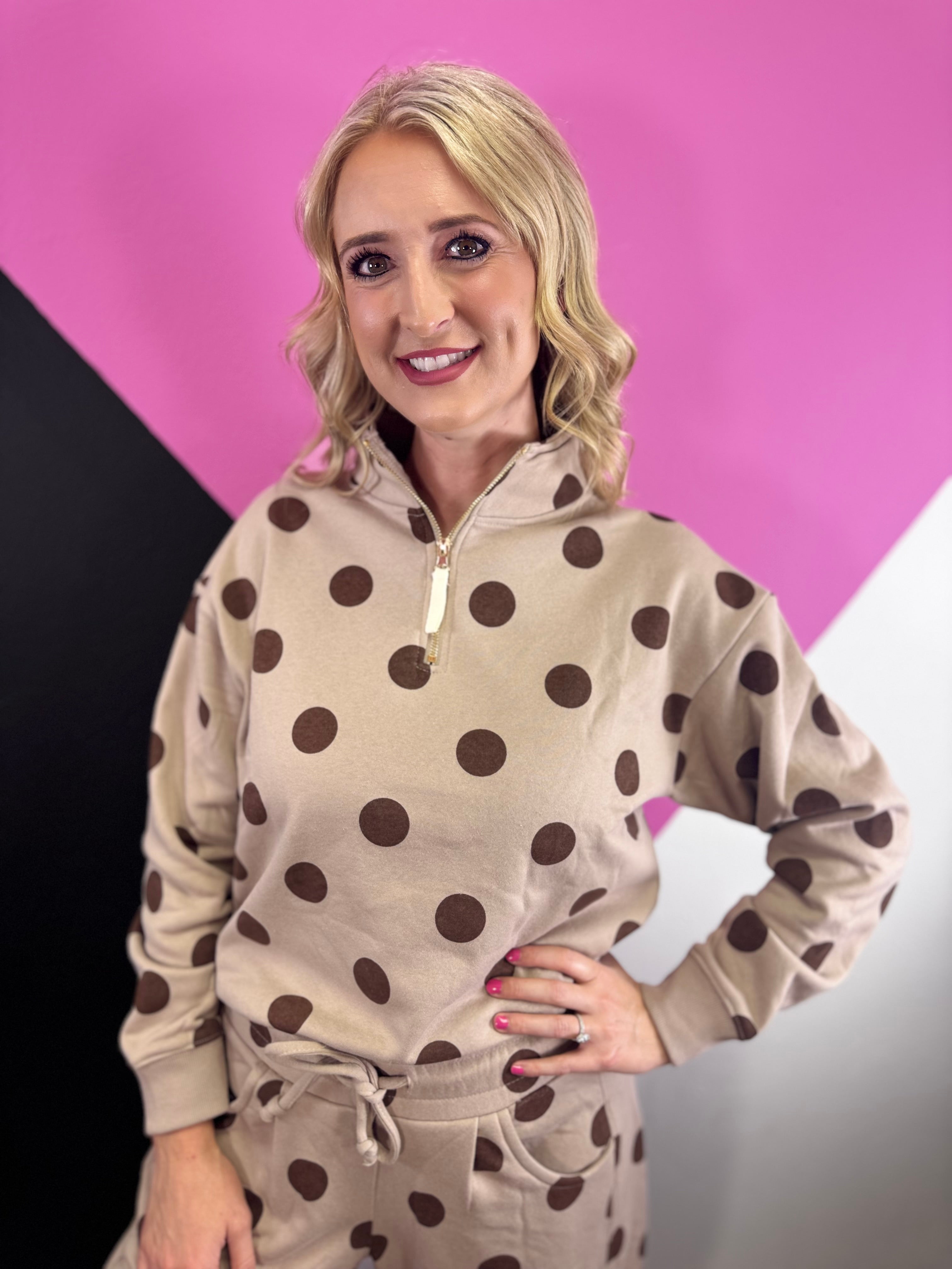 Ash mocha quarter-zip pullover with brown polka dots, long sleeves, and ribbed trim.