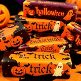 Halloween butter stick squishy toys with pumpkins, ghosts, bats, and trick-or-treat designs.