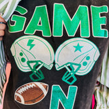 Close up of Sleeveless black tee with green graphics, helmet, and football.