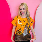 Queen of Sparkles Orange Sequin Halloween-themed shirt with pumpkins, bats, and a moon. 