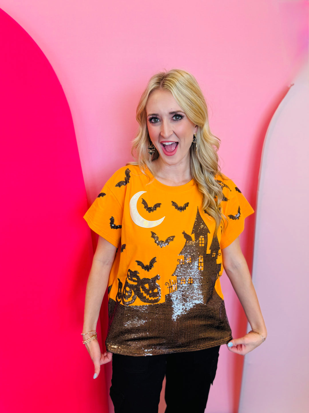 Queen of Sparkles Orange Sequin Halloween-themed shirt with pumpkins, bats, and a moon. 