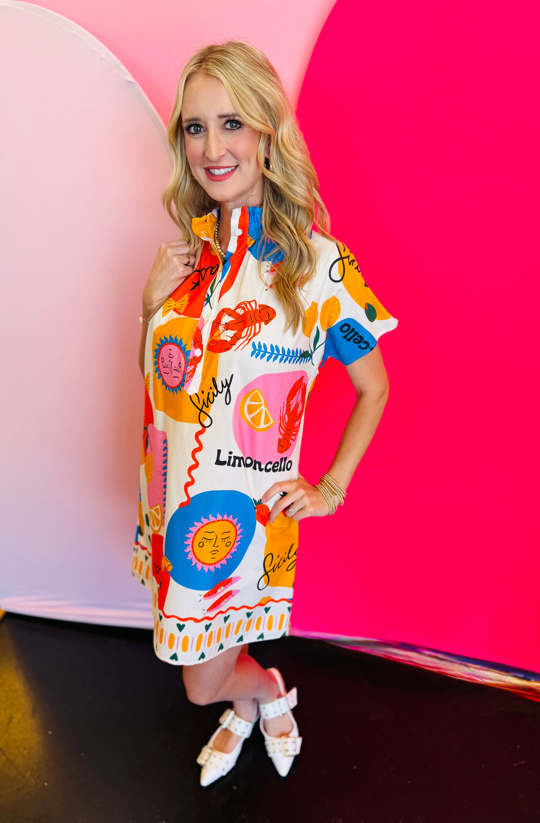 Side profile of the Sicily Calls Dress emphasizing the flattering shift shape, side seam flow, and colorful Mediterranean-inspired print for a sun-ready statement.