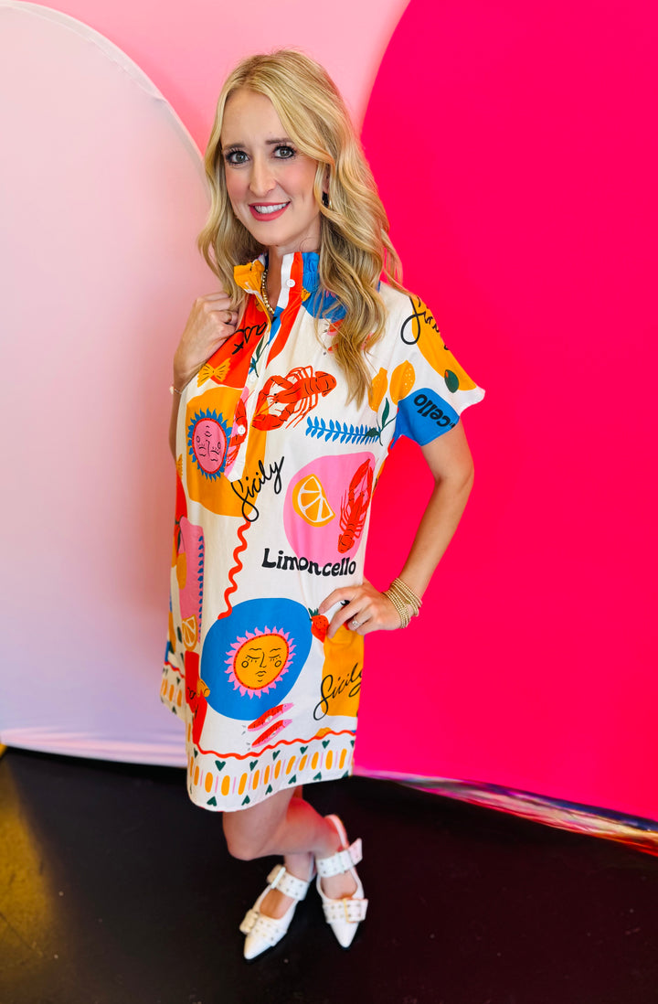 Side profile of the Sicily Calls Dress emphasizing the flattering shift shape, side seam flow, and colorful Mediterranean-inspired print for a sun-ready statement.