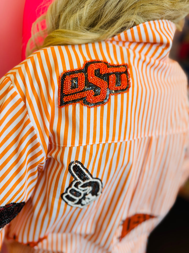 Close up of Queen Of Sparkles orange and white striped icon Oklahoma State University game day blouse.