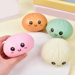 Baby dumpling squishy stress toy in assorted mystery colors.