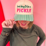 Cream pickleball hat with pink embroidery and green striped bill.