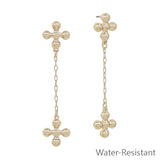 Water resistant 1.5" dangle earrings with ball-shaped cross on chain, lead and cadmium safe.