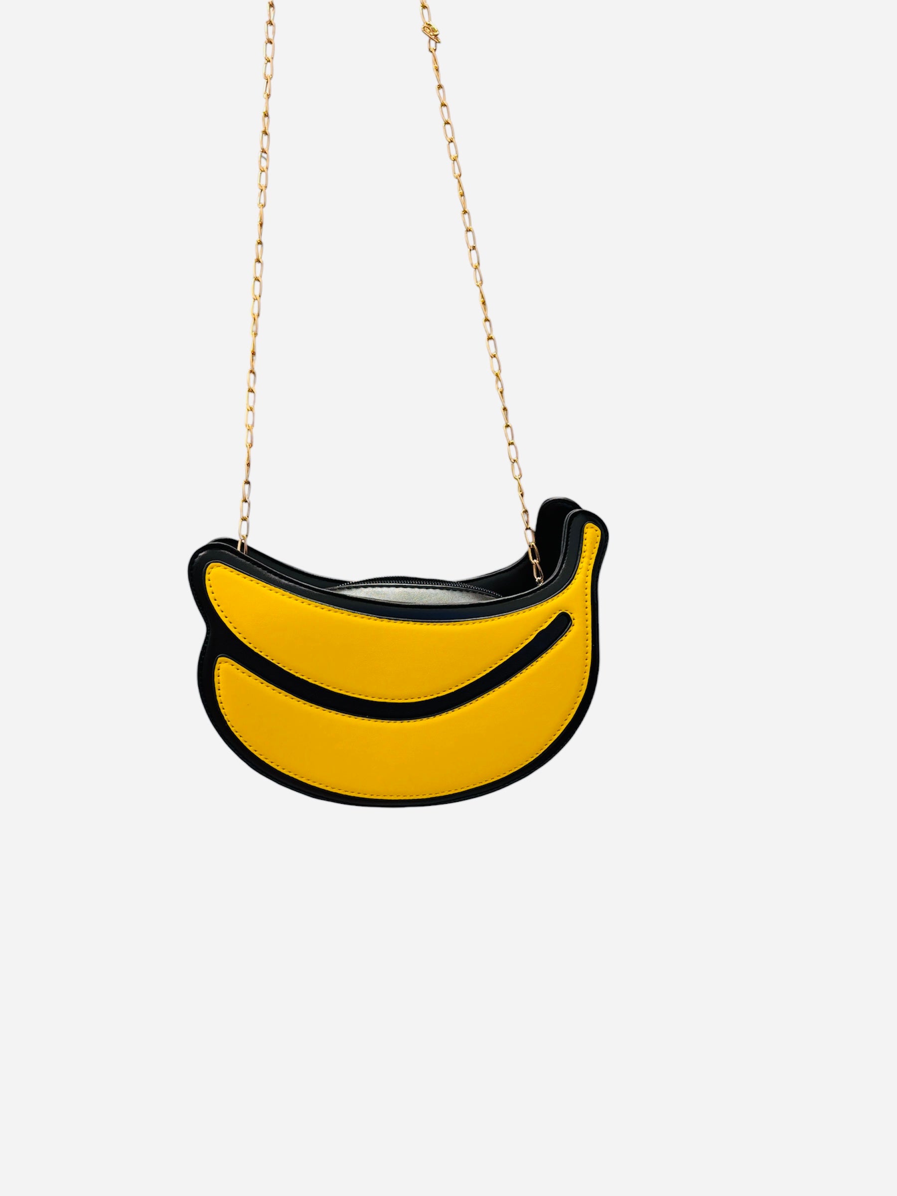 Yellow banana shaped crossbody bag with gold chain strap and zip closure.