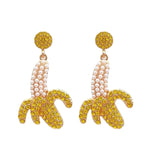 Banana shaped earrings with gold glitter accents and pearl bead details