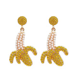 Banana shaped earrings with gold glitter accents and pearl bead details
