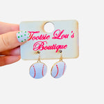 Baseball dangle earrings with white finish, red stitching, glossy surface, and lightweight design.