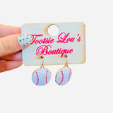 Baseball dangle earrings with white finish, red stitching, glossy surface, and lightweight design.