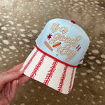 Light blue It’s A Good Day baseball hat with red stitched brim and rope detail.