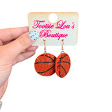 Basketball dangle earrings covered in sparkling rhinestones.
