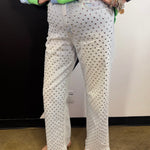Light wash straight leg jeans with allover rhinestone embellishments and high-rise waist.
