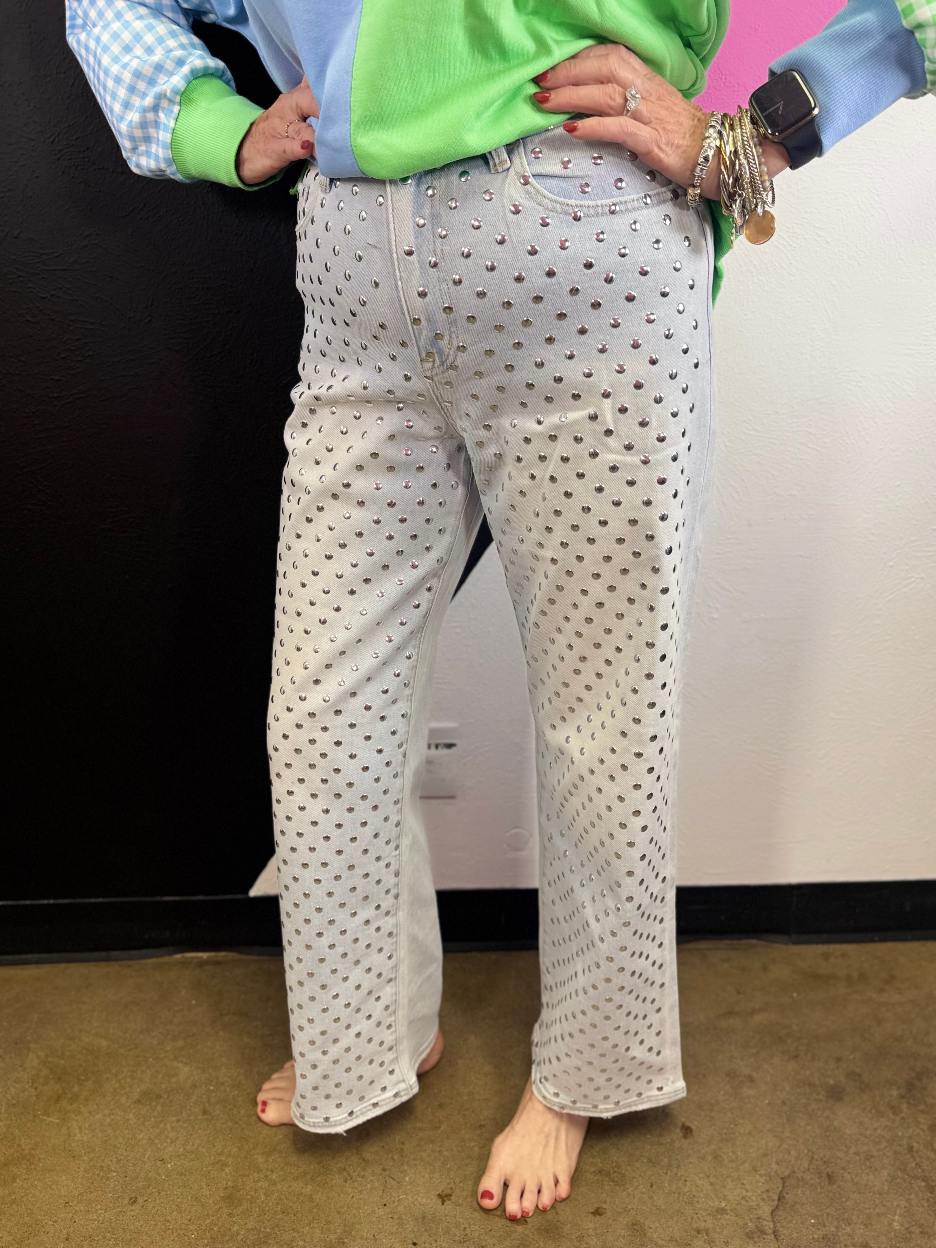 Light wash straight leg jeans with allover rhinestone embellishments and high-rise waist.