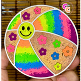 Beach ball freshie with smiley face, flowers, and glitter accents.