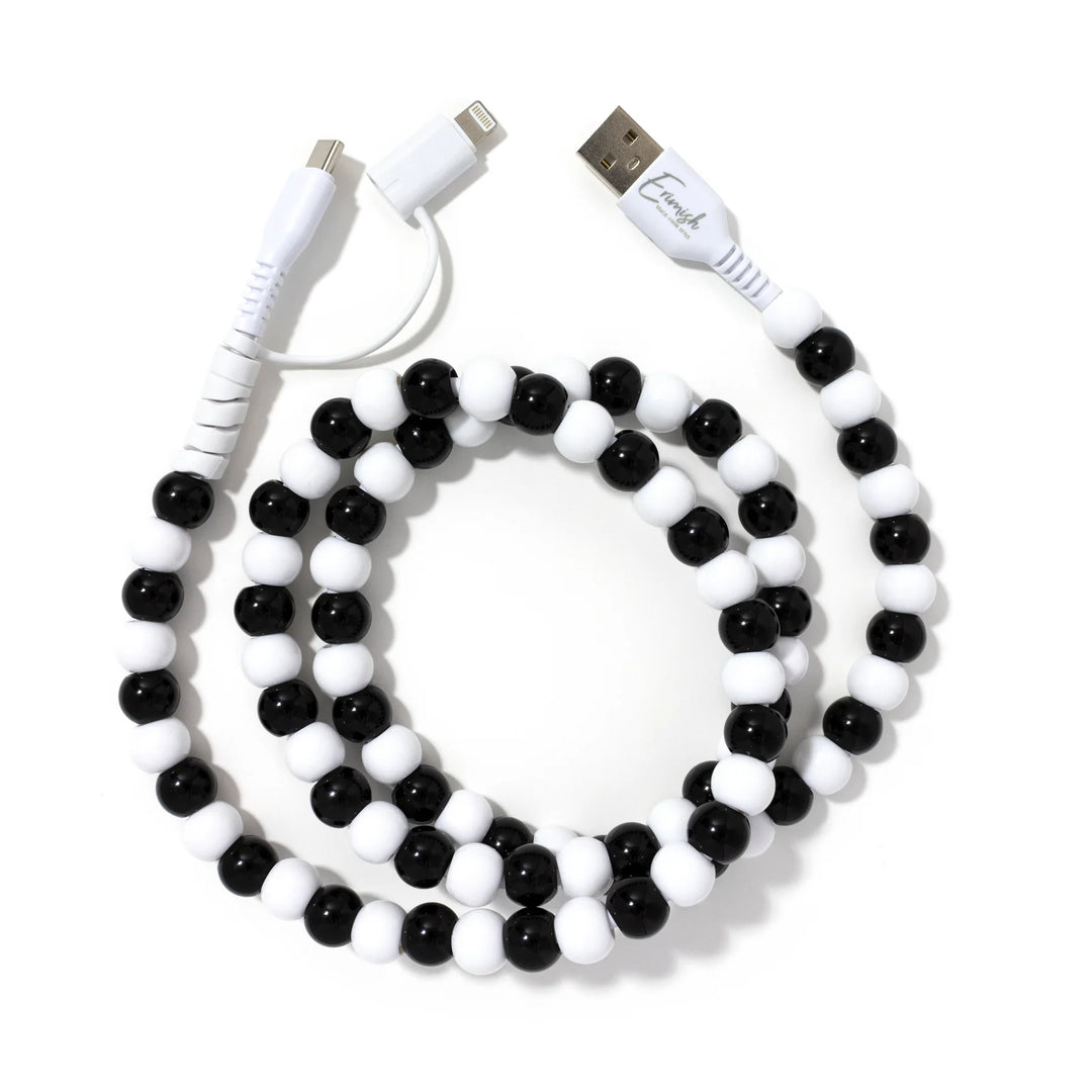 A stylish black and white beaded phone charger cable.