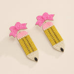 Handmade beaded pencil earrings with pink bow accent, perfect teacher back-to-school jewelry.