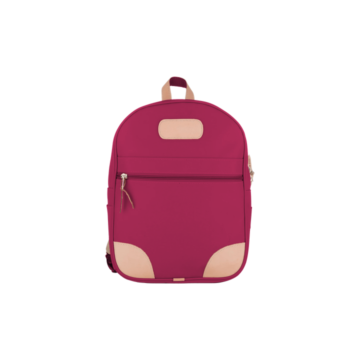 Jon Hart berry coated canvas backpack with Natural Leather trim, front zip pocket, two side pockets, and adjustable leather-detailed straps.
