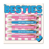 Set of five Besties pens with funny friendship quotes in black ink on colorful barrels.