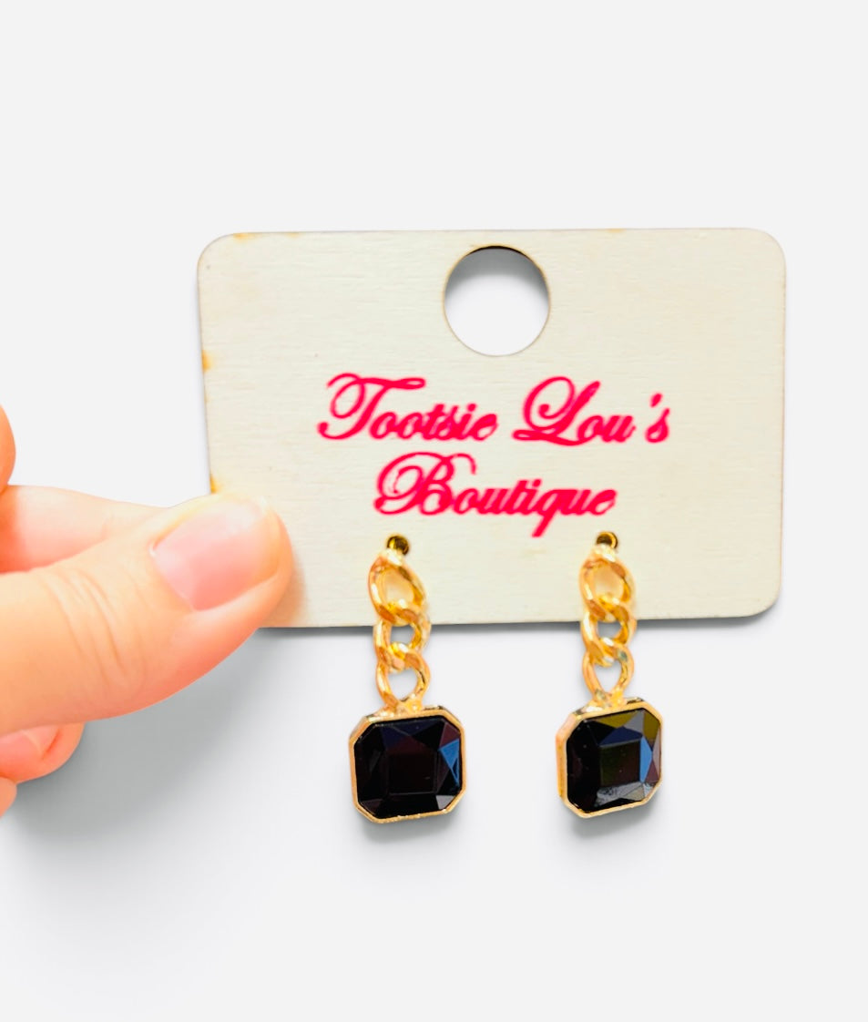 Black square crystal drop earrings with chunky gold-tone chain links.