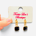 Black square crystal drop earrings with chunky gold-tone chain links.
