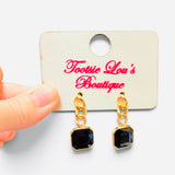 Black square crystal drop earrings with chunky gold-tone chain links.