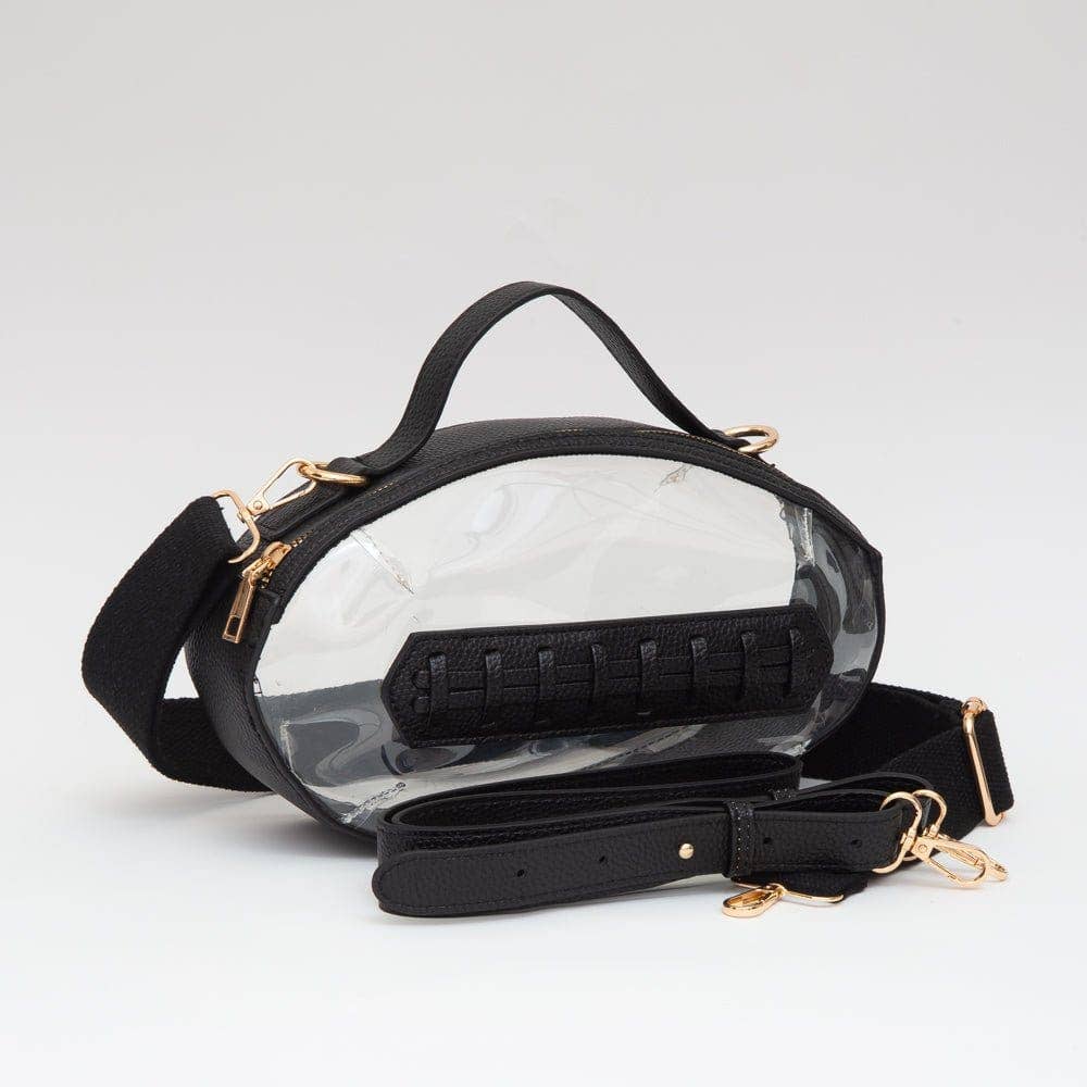 Clear football crossbody bag with black vegan leather trim, gold hardware, top handle, and adjustable strap.