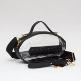 Clear football crossbody bag with black vegan leather trim, gold hardware, top handle, and adjustable strap.