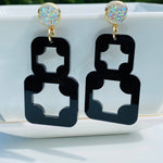 Black geometric acrylic earrings with AB druzy studs and gold-plated accents.