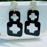 Black geometric acrylic earrings with AB druzy studs and gold-plated accents.