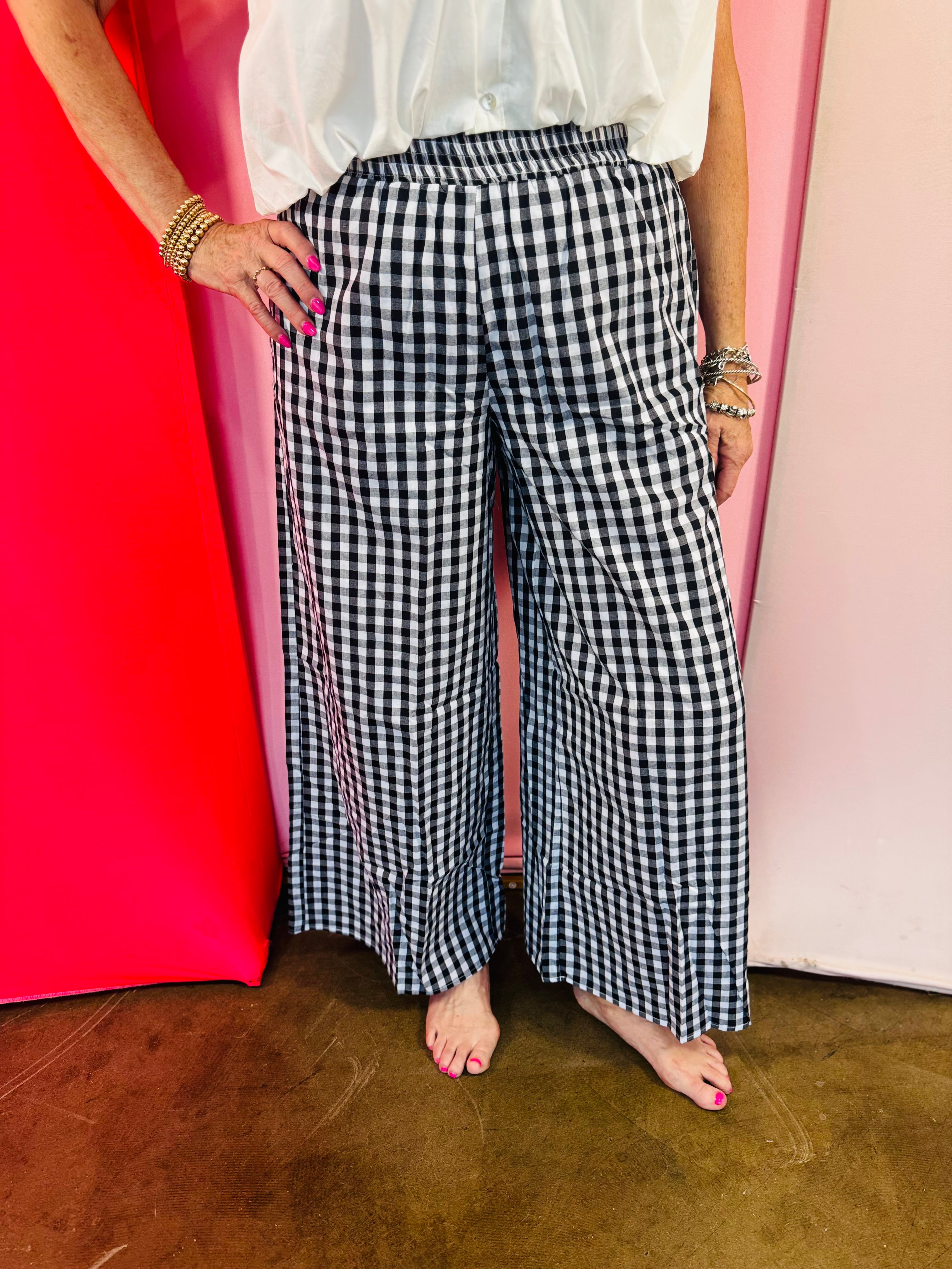 Black and white gingham wide leg pants with a smocked waistband.