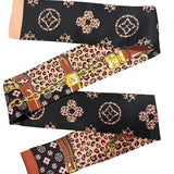 Black 47 inch scarf with leopard boujee print and chain link design styled as necklace