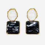 Black and pearl gold-tone resin dangle earrings