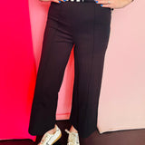Black wide leg ponte pants with front pintuck seam and elastic waistband.