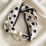 Black and white polka dot scarf necklace with lustrous pearl accents.