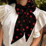 Black and red silky Latigo scarf with versatile styling options.