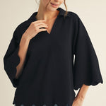Black scalloped V-neck top with collar and 3/4 sleeves, made from soft, lightweight stretch fabric.