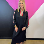 Black half-zip maxi dress with red, cream, and tan stripes and long sleeves.
