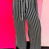 Black and white striped wide leg pants with elastic waistband and pockets.