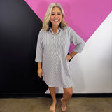 Black striped collared shirt dress with button front, chest pocket, and three-quarter sleeves