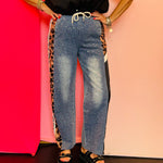 Denim joggers with rhinestone crystal details and leopard print panels.