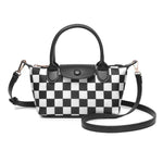 Black and white checkered crossbody bag with dual handles, gold hardware, and adjustable strap.