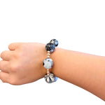 Black and white marbled bubble bracelet with oversized acrylic beads and gold accents.