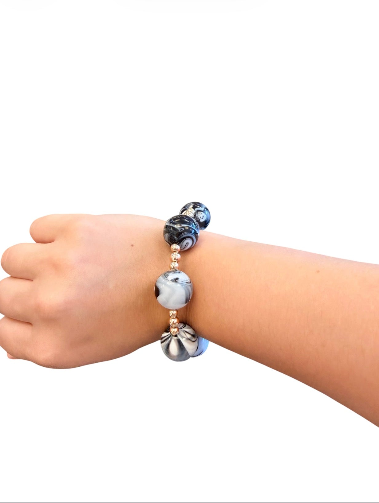 Black and white marbled bubble bracelet with oversized acrylic beads and gold accents.