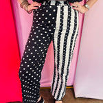Black and white wide leg pants with polka dot and stripe panel design.