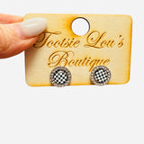Black and white checkered rhinestone stud earrings with sparkling encrusted finish.